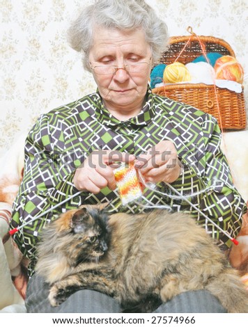 pet lie on legs elderly woman