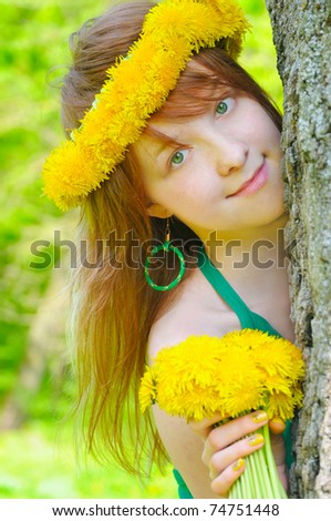 girl with red hair and diadem from yellow dandelions on head