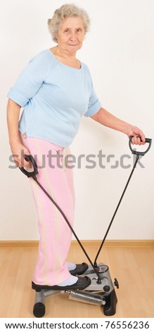 old woman do morning exercise on trainer
