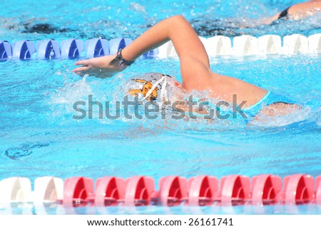 Man swimming laps in a community competition swimming pool