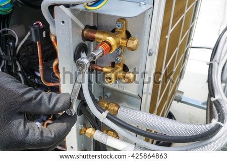 Close up air conditioner service and shut off valve
