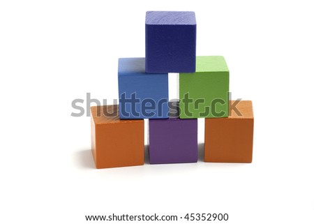 Tower of six colorful blocks isolated on white