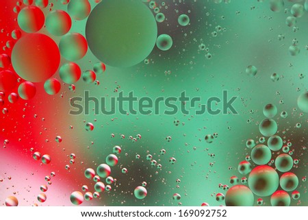 Abstract red and green bubbles - oil on water