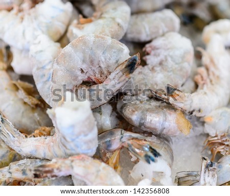 Raw frozen shrimps close up