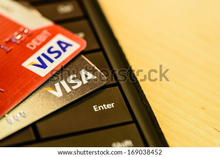 Boston, Usa - December 29, 2013: Visa Credit And Debit Cards Over Keyboard