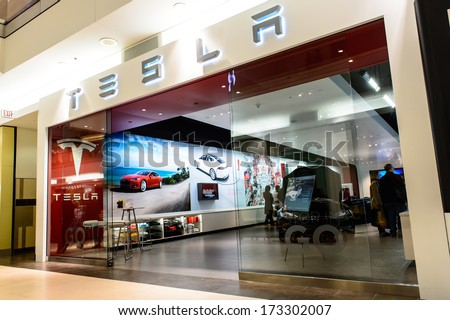 NATICK - JANUARY 25, 2014: Exterior view of a Tesla motors store in the mall on January 25, 2013 in Natick, USA. Tesla Motors produced the Tesla Roadster, the first fully electric sports car.