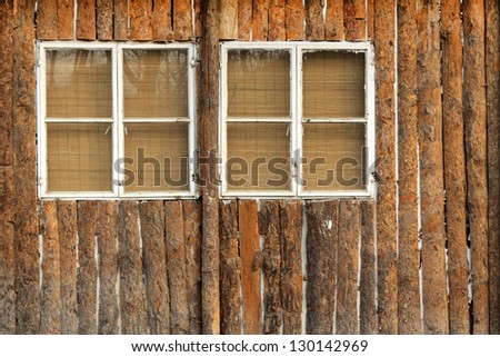windows on the brown wooden wall in a park, china