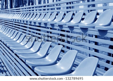 empty colorful stadium seats in a university campus, beijing, north china