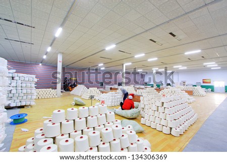 LUANNAN - NOVEMBER 20, 2012: Piles of spindles stacked together in a warehouse in the Zeao spinning company, in November 20, 2012, Luannan County, china.