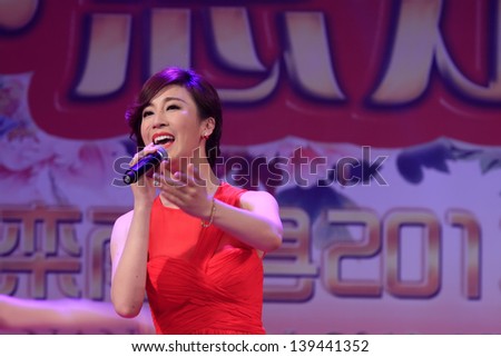 LUANNAN COUNTY - FEBRUARY 22: In the Chinese Lantern Festival Evening Party, the famous singer Guo Tao singing songs on stage, on February 22, 2013, Luannan County, Hebei Province, China.