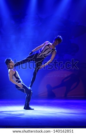 LUANNAN COUNTY - FEBRUARY 22: In the Chinese Lantern Festival Evening Party, Young male actors performing modern acrobatics on stage, on February 22, 2013, Luannan County, Hebei Province, China.