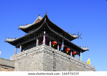 tower over a city gate, ancient Chinese style in a scenic spot, china
