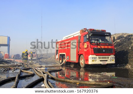 TANGSHAN - NOVEMBER 20: prepare to leave the scene of the fire fighting vehicles and personnel after the fire, November 20, 2013, tangshan city, hebei province, China.