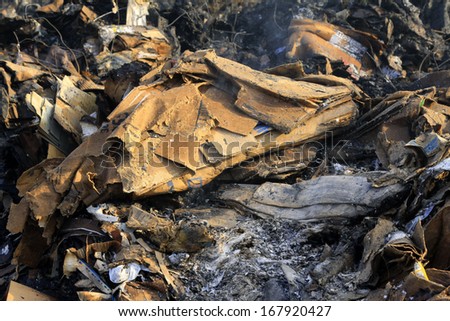 wet cardboard  not fully burning in the scene of the fire, tangshan city, hebei province, China.
