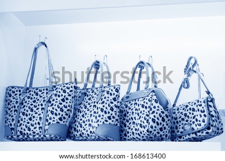 TANGSHAN - NOVEMBER 16: Ms color bag were put on the shelf in a store, on November 16, 2013, tangshan city, hebei province, China.