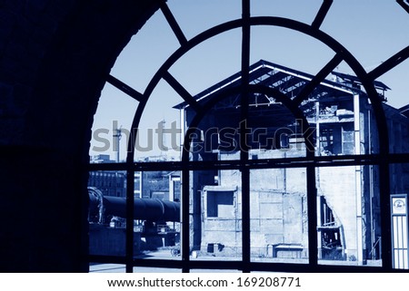 abandoned factories outside the window, closeup of photo