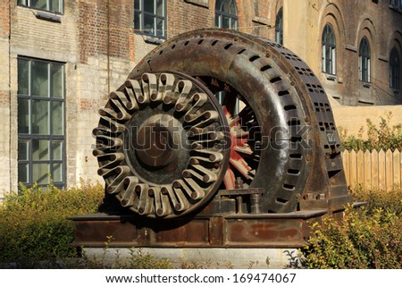 TANGSHAN - NOVEMBER 4: The abandoned large asynchronous motor in the Qixin cement plant on november 4, 2013, tangshan city, hebei province, China.