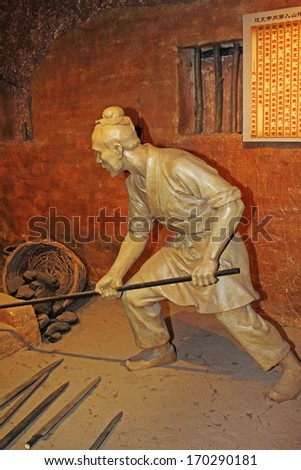 TANGSHAN - OCTOBER 18: The han dynasty iron smelting sculpture in kailuan museum on october 18, 2013, tangshan city, hebei province, China.