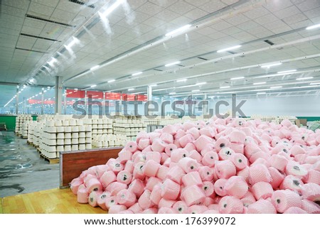 LUANNAN COUNTY - DECEMBER 20: Cotton reel thread piled up together in a production workshop, in the ZeAo spinning LTD., on December 20, 2013, Luannan county, hebei province, China.