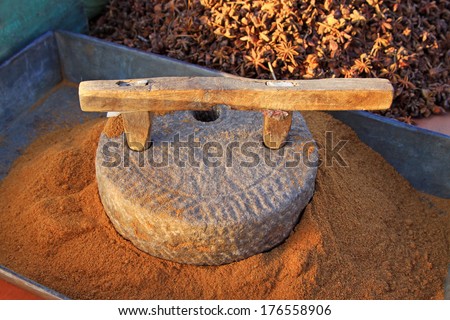 stone mill in a dressing stall, closeup of photo