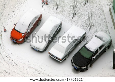 TANGSHAN CITY - JANUARY 16: Cars covered with snow on january 16, 2014, tangshan, china.