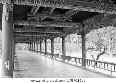 BEIJING - JANUARY 17: Long corridor and tourists in the temple of heaven park, on January 17, 2014, Beijing, China.