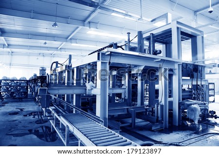 LUANNAN COUNTY, CHINA - JANUARY 5: Molding workshop machinery and equipment in a warehouse, in the ZhongTong Ceramics Co., Ltd. January 5, 2014, Luannan county, Hebei Province, China.