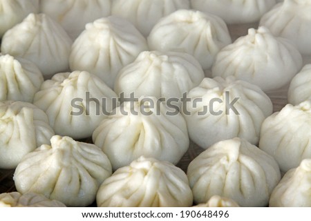 steamed stuffed bun in the dish on the white background