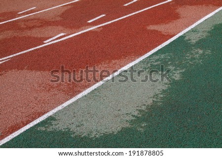 wet plastic runway in a sports ground in a middle school