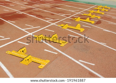 run up ware on red plastic runway in a sports ground in a middle school