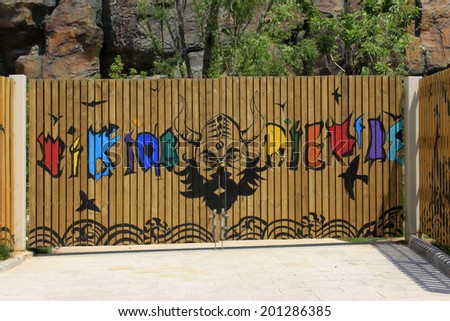 TIANJIN - MAY 17: graffiti works on the wooden door, Happy Valley, on May 17, 2014, Tianjin, China.
