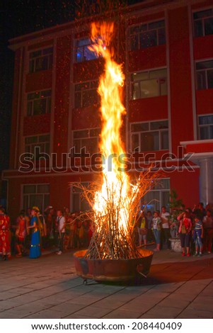 INNER MONGOLIA AUTONOMOUS REGION - JULY 18: bonfire party scene in WuLanBuTong grassland, on July 18, 2014, Inner Mongolia autonomous region, China