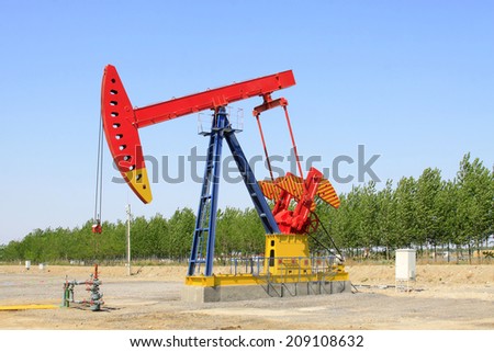 CAOFEIDIAN - MAY 2: crank balanced beam pumping unit in the JiDong oilfield, on may 2, 2014, caofeidian, hebei province, China.