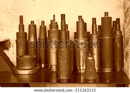 cylinder metal parts piled up together, closeup of photo