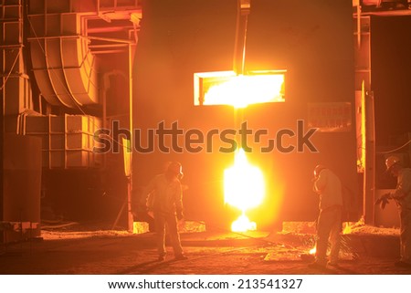 TANGSHAN - JUNE 20: steel mills converter workers tense work, on June 20, 2014, Tangshan city, Hebei Province, China