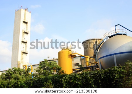 TANGSHAN - JUNE 20: Fractionating column and metal cans, on June 20, 2014, Tangshan city, Hebei Province, China