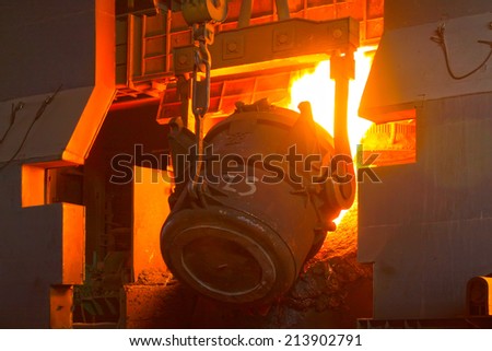 TANGSHAN - JUNE 18: converter filling scrap iron and steel, in a iron and steel co., on June 18, 2014, Tangshan city, Hebei Province, China