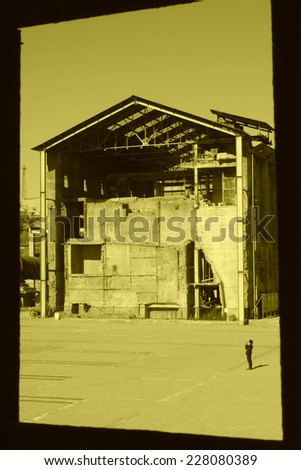abandoned factories outside the window, closeup of photo