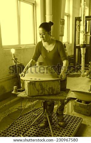 LUANNAN COUNTY - JANUARY 5: The women workers in the production line, in the ZhongTong Ceramics Co., Ltd. January 5, 2014, Luannan county, Hebei Province, China.