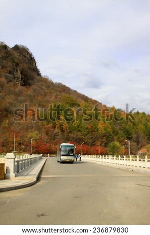 BENXI CITY- OCTOBER 12: Tour buses driving in GuanMenShan scenic, on october 12, 2014, Benxi City, Liaoning Province, China