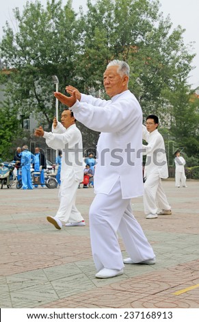 LUANNAN COUNTY - SEPTEMBER 20: Old men boxing performance in a square on September 20, 2014, Luannan county, Hebei Province, China