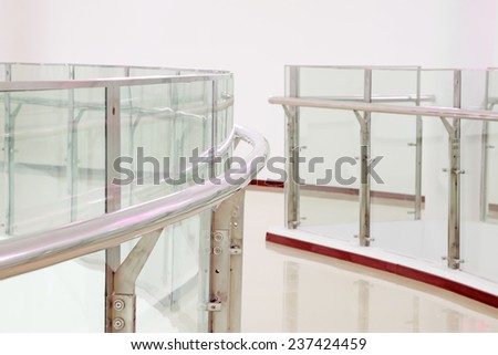 glass curtain wall and stainless steel rail, closeup of photo
