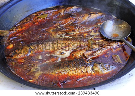 Chinese cuisine cooking - Large pot stewed fish in a restaurant