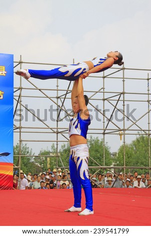 LUANNAN COUNTY - AUGUST 9: acrobatic performance on stage, on august 9, 2014, Luannan County, Hebei Province, China.
