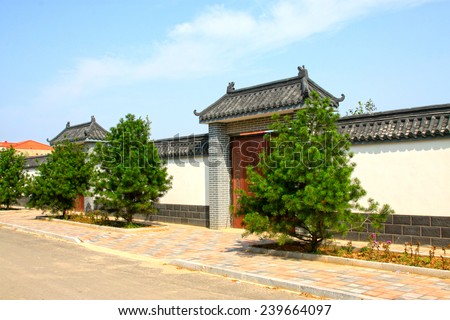 LUANNAN COUNTY - AUGUST 7: traditional Chinese architectural style gate house and walls in the countryside,  on august 7, 2014, Luannan County, Hebei Province, China.