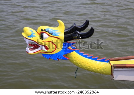 Wood carving in dragon boat in a park, north china