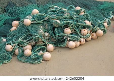 Nylon fishing nets and floats, closeup of photo
