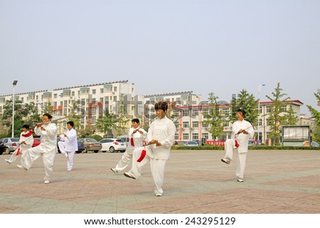 LUANNAN COUNTY - SEPTEMBER 20: Old women Fencing performance in a square on September 20, 2014, Luannan county, Hebei Province, China