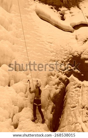 ice climbing enthusiasts use rope, climbing a frozen waterfall, on January 18, 2014, QingLong, hebei province, China.