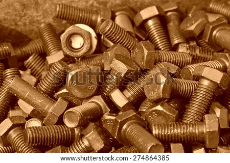 bolts piled up together, closeup of photo